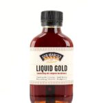 Liquid Chili Gold in Glasfläschen, beiges Etikett mit Produktname in Front, schwarzer PET Schraubdeckel