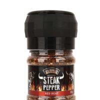 red heat steak pfeffer in transparenter PET Dose, schwarzes Etikett mit Produktname und Hörnern in Front, schwarze Deckelmühle